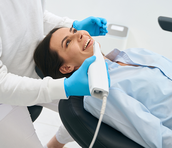 Dental patient having scans of her teeth taken