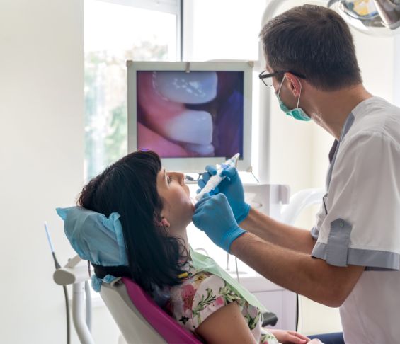 Dentist capturing close up photos of a patients teeth